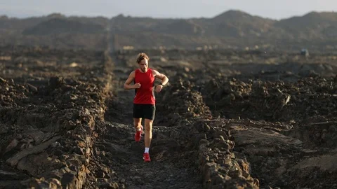 Running athlete man looking at heart rate monitor smart watch Video stock 70271253