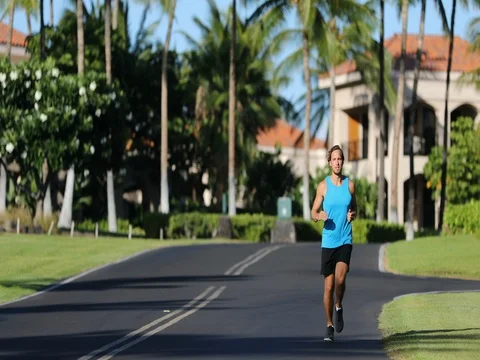 Running athlete man runner training cardio on road Stock Footage 76810027