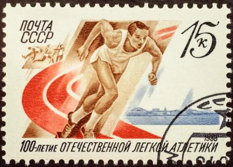 Running athlete on post stamp Foto stock