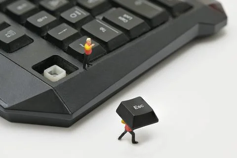Running Away From A Boss Supervisor from a computer keyboard Stock Photos
