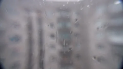 Running back drops of rain on glass Video stock 35607838