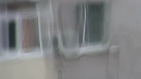 Running back drops of rain on glass Stock Footage 35608243