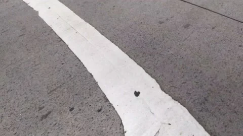 Running backward white stripes of gray concrete road Stock Footage 136797761