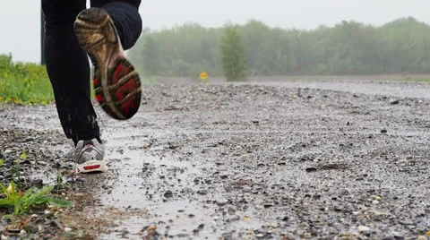 Running in bad weather Stock Footage 24015367