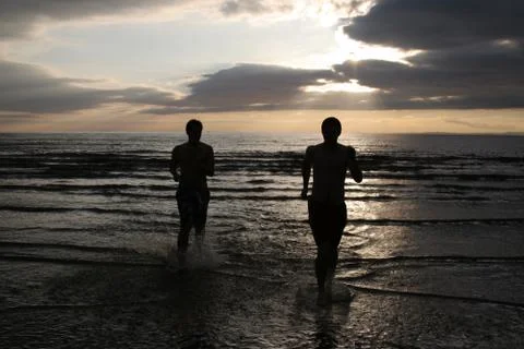 Running at the beach Stock Photos