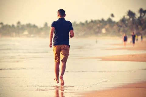 Running on the beach Stock Photos