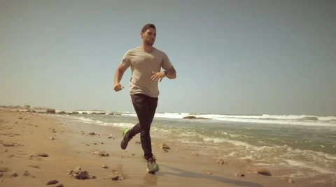Running on the beach in slow motion Stock Footage 61460205