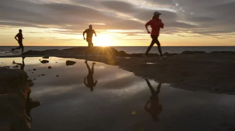 Running on beach at sunrise Stock Footage 43297370
