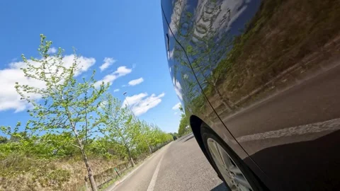 Running car and blue sky Stock Footage 243856867