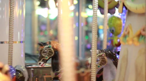 A running carousel in an amusement park Stock-Footage 66637255