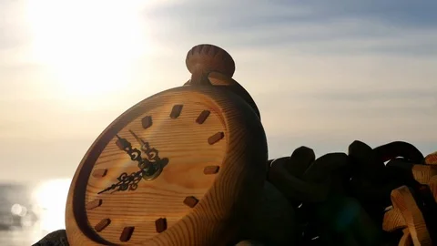 Running clock against sun with sea background time lapse Stock Footage 75873904