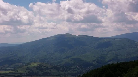Running Clouds With Mountain Range and Trees Timelapse. Carpathian Mountains Stock Footage 85287944