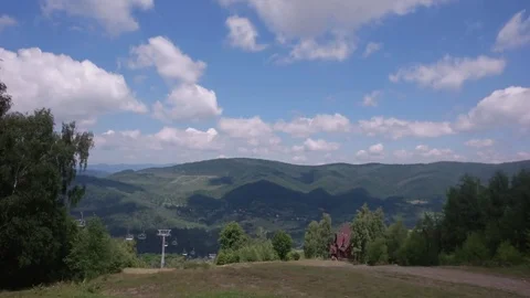 Running Clouds With Mountain Range and Trees Timelapse. Carpathian Mountains Stock Footage 85361009