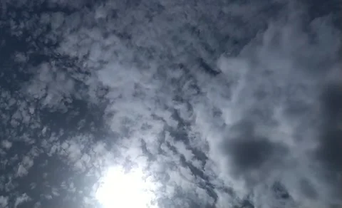 Running Clouds in sunny sky in beginning of rainy season. Stockbeeldmateriaal 133870934