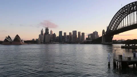 Running clouds in Sydney over CBD high-rise towers and harbour bridge – 4k. Stock Footage 139570412