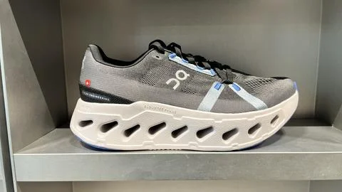 On Running Cloudsurfer sneakers with CloudTec Phase technology on display a.. Stock Photos