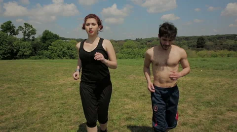 Running couple jogging in the park Stock-Footage 41761276