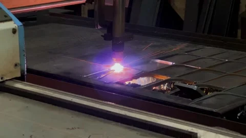 Running cutting laser plasma is making pattern on the iron plate Stock Footage 269753761