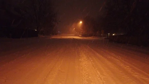 Running in the Dark in the Snow Stock Footage 124794672