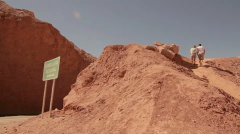 Running up a desert hill Stock Footage 60676164