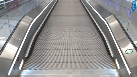 Running a direct escalator in a mall Stock Footage 102348867