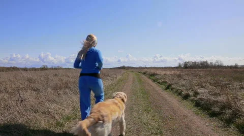 Running with dog. Stock Footage 49464428
