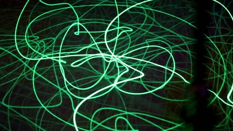 Running drawing green light beam on black background. Scientific concept. Stock Footage 97124902