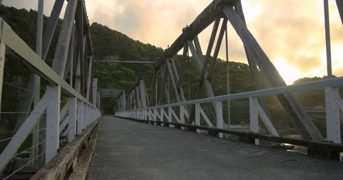Running at dusk through bridge Stock Footage 79996427