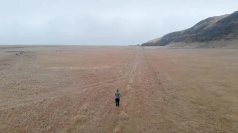Running on empty field in Iceland Stock Footage 259720082