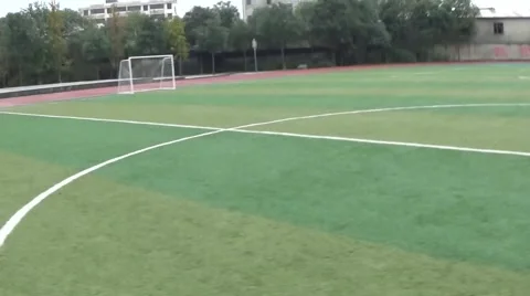 Running on an empty soccer field in a high school, POV shot Stock Footage 44084959