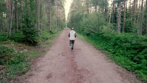 Running in forest, drone shot. Stock Footage 278733075