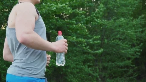 Running guy with a bottle of water Stock Footage 81301105