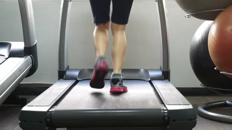Running in a gym on a treadmill concept for exercising Stock Footage 61851982