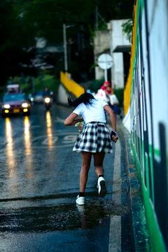 Running home in the rain Stock Photos