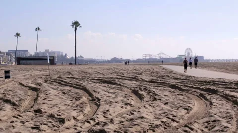 Running jogging people sand beach ferris wheel Los Angeles California Stock-Footage 44753623