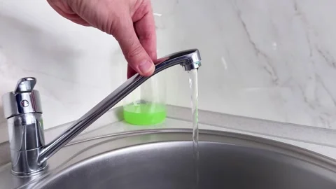 Running Kitchen Faucet Close Up with Flowing Water Stream Sink Demo Video stock 329828095