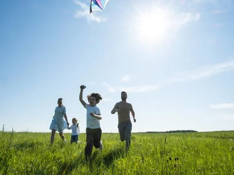 Running with kite on summer vacation Stock Photos