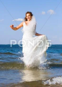 Running laughing bride Stock Photos
