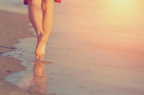Running legs of runner on beach Foto stock