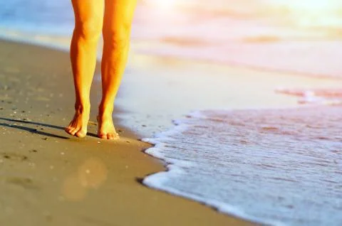 Running legs of runner on beach Fotos Stock