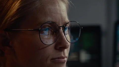 Running Lines of Computer Code Reflecting on Female Specialists Glasses Stock Footage 288790935