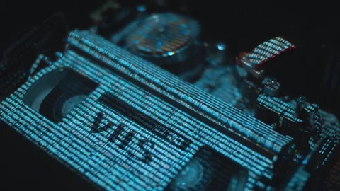 Running lines of data are projected onto the cassette and tape drive mechanism Stock Footage 313150974