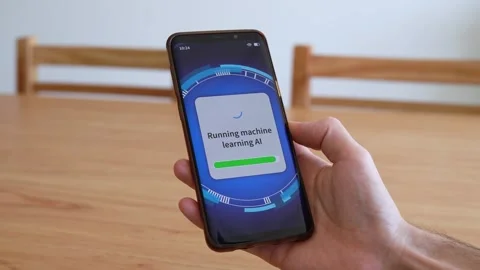 Running machine learning AI system on smartphone. Concept of updating Stock Footage 321357923