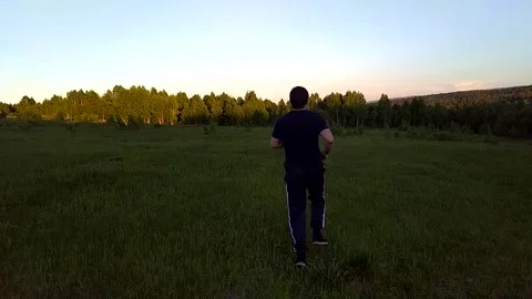 Running man across the field-3 Stock Footage 156187115