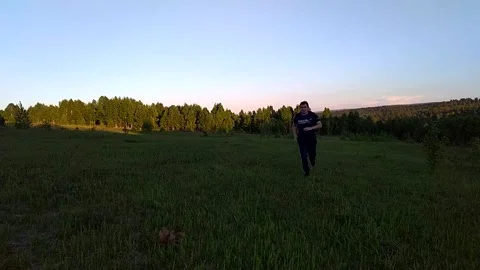 Running man across the field Stock Footage 156187110