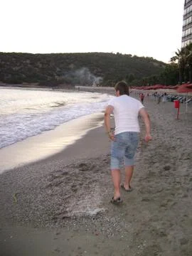 Running man on the beach Stock Photos