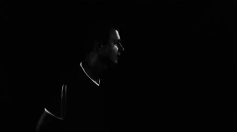 Running man on the dark background Stock Footage 64344936