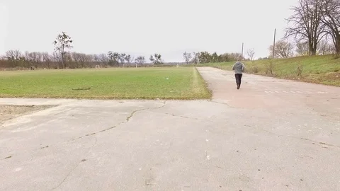 Running man at dirty stadium Stock Footage 74167470