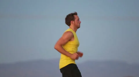 Running man jogging on road Stock Footage 31862706