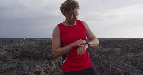 Running man looking at smart watch heart rate monitor smartwatch Stock Footage 85452580